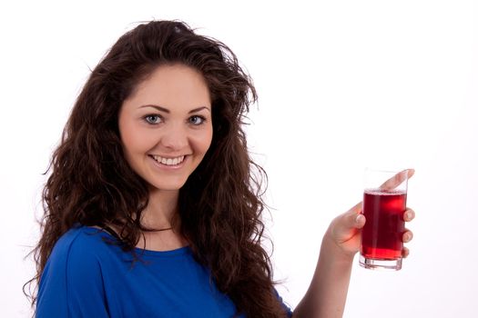 beautiful smiling brunette woman is drinking red juice isolated on white