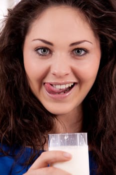 beautiful smiling woman is drinking milk isolated on white background