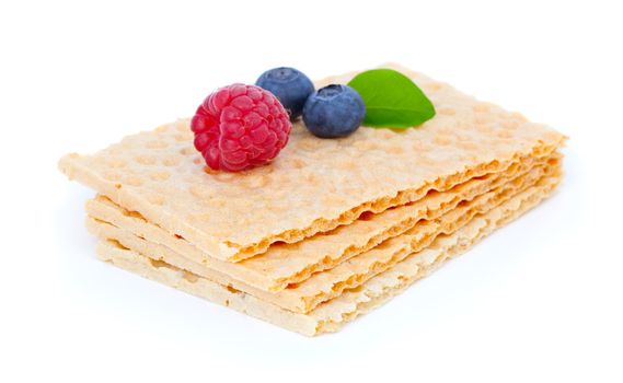crispbread with raspberries and blueberry, isolated on a white background