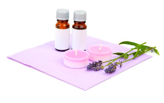 Lavender oil, candle and lavender flower, isolated on white background