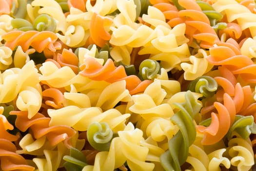 Raw italian pasta isolated on white background