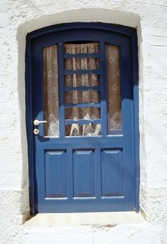 Blue door at the Parikia village, Paros island, Cyclades, Greek