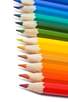 Coloured pencils with shadow on white background