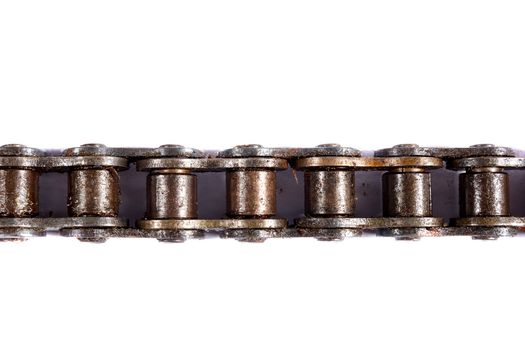 close up of oily motorcycle chain on a white background