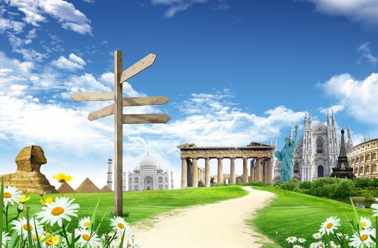 World landmarks with direction panel in he grassland with blue sky and clouds in the background