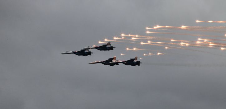 Aerobatic team 'Swifts' on the MiG-29 fighter fires a missile thermal