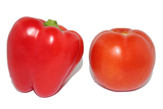 Red sweet pepper and red tomato on a white background
