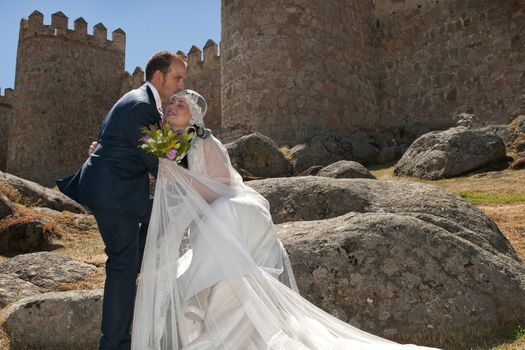 Beautiful bride and loving groom on their wedding day