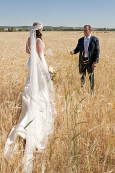 Beautiful bride and loving groom on their wedding day