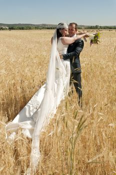 Beautiful bride and loving groom on their wedding day