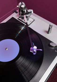 Long Playing record LP on retro record player with tone arm and cartridge