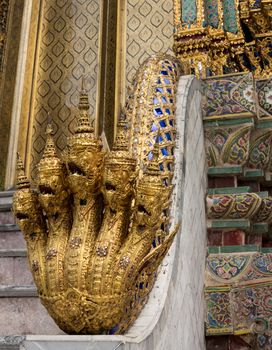 Grand Palace in Bangkok Thailand with ornate multi headed Naga or cobra snakes