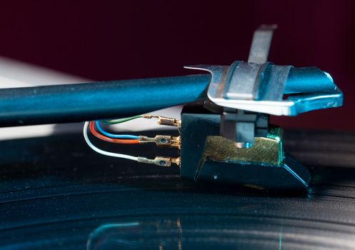 Long Playing record LP on retro record player with tone arm and cartridge