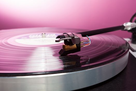Long Playing record LP on retro record player with tone arm and cartridge