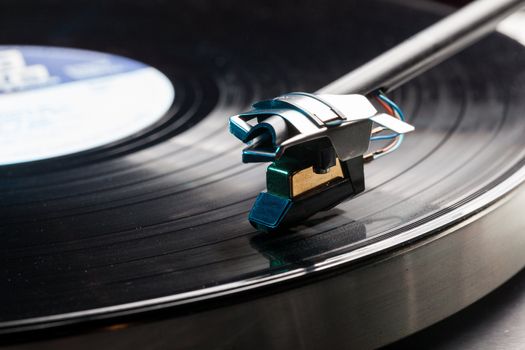 Long Playing record LP on retro record player with tone arm and cartridge