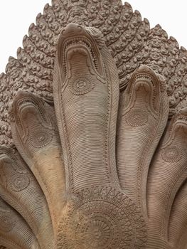 Detailed carving on wall of Angkor wat temple in Cambodia on cloudy day