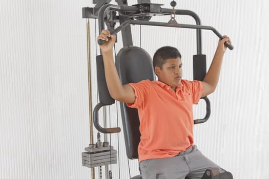 Thai boy lifting weights