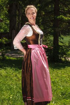 Blonde woman in a Bavarian folk costume