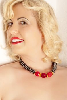 Portrait of a blond woman with a beautiful necklace