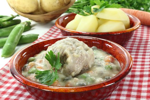 delicious fresh cooked meatballs in a white sauce with capers, garlic and parsley