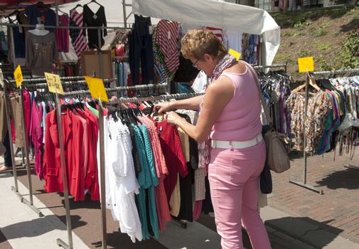 woman shopping clothes on the market