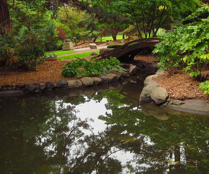 A photograph of an Asian style garden located at a public park.