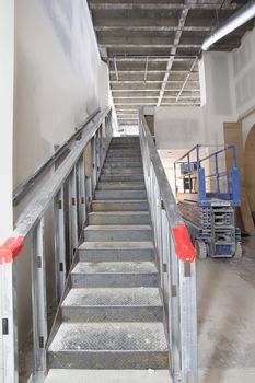 Steel Staircase Construction in Commercial Space  Mezzanine with Metal Studs Support