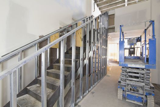 Steel Staircase Construction in Commercial Space with Metal Studs Support