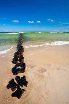 Beach erosion barrier on sandy baltic sea beach intended to minimize beach and sand erosion.