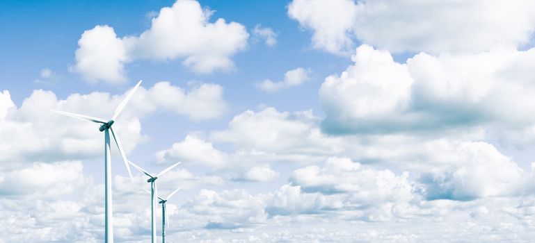 Wind turbines in front of cloudy sky