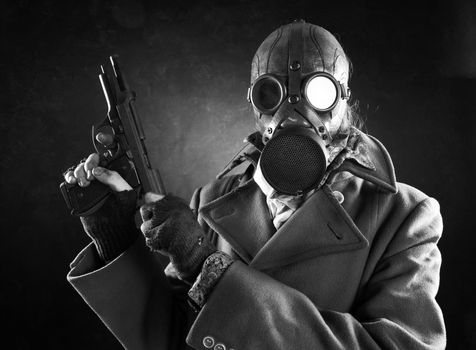 grunge portrait man in gas mask  with gun