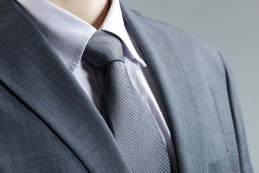 Close up of classic business attire with  tie and elegant blazer.