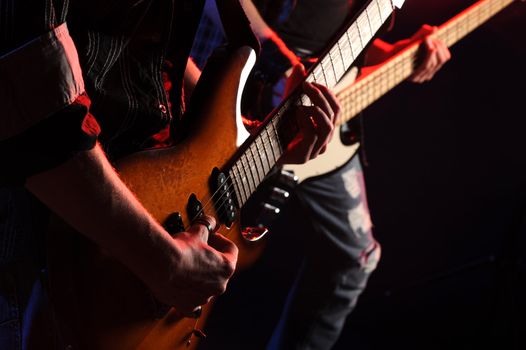 rock musicians playing at a live concert