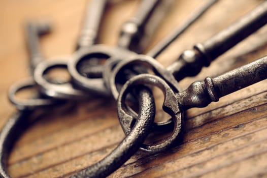 old keys on a wooden table, close-up