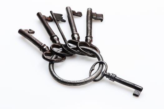 old keys on white background, close-up