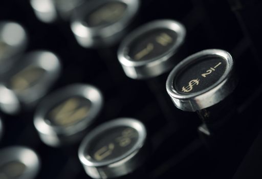 Close up photo of antique typewriter keys, shallow focus