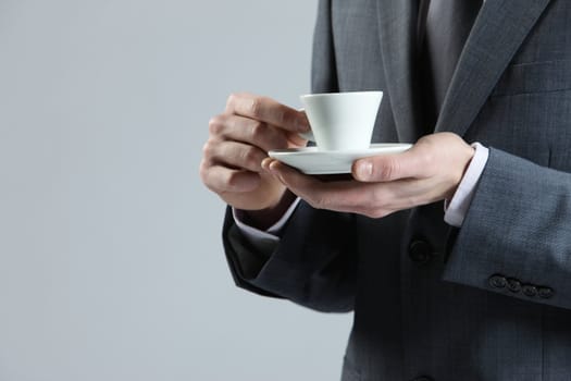 close up business man with coffee cup