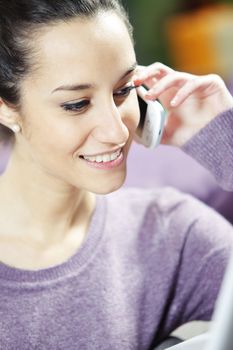 young smiling woman on phone