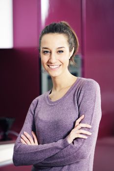 portrait of beautiful young woman in kitchen