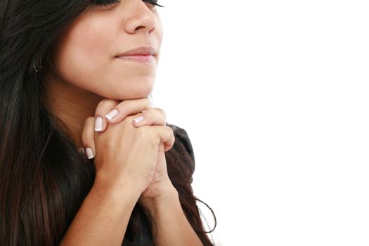 Closeup portrait of a young woman praying