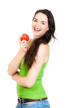 A beautiful young woman holding an apple and laughs. Isolated on white