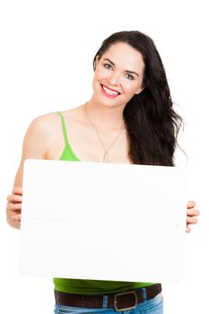 A beautiful happy young woman holding a blank billboard sign. Isolated on white.