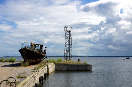 Mooring and boat on a background of clouds