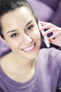 young smiling woman on phone