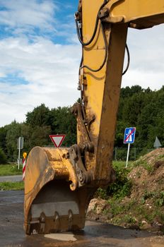 Excavator being parked at a highway construction site in Germany