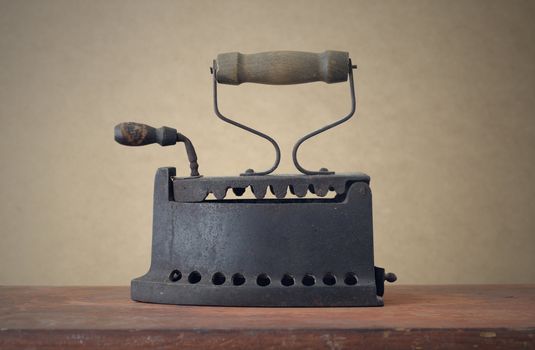 Old Iron on a wooden table