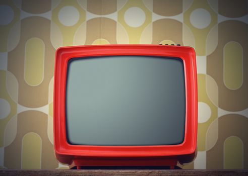 Old TV on vintage background