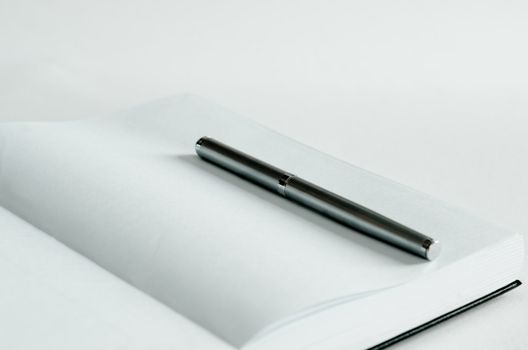 Open note book and pen for records .