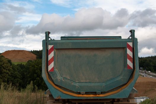 Dump truck being parked at a highway construction site in Germany