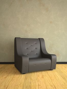 Black leather armchair near an old wall